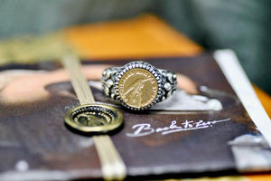 Hand Holding Feather Pen Latin Motto Fleur De Lis Signet Ring - Backtozero B20 - 12f, 12mm, 12mm ring, 925 Silver, accessory, Fleur de Lis, him, Intaglio, Intaglio ring, jewelry, knowledge, latin, latin motto, learn, Message, ring, seal, seal ring, signet, size 10, size 11, size 8, size 9, wax seal, wax seal stamp, wisdom