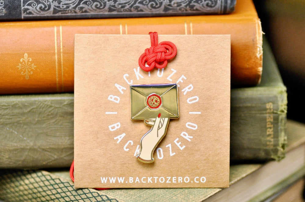 Hand Holding Wax Seal Letter Enamel Pin | Gold - Backtozero B20 - enamel, Gold, hand, hand gesture, hard enamel, hard enamel pin, her, hold, holding, lapel, Letter, Letters, love letter, mail, metal, metal pin, pin, Red, wax seal