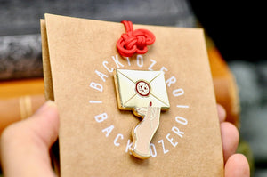 Hand Holding Wax Seal Letter Enamel Pin | Gold