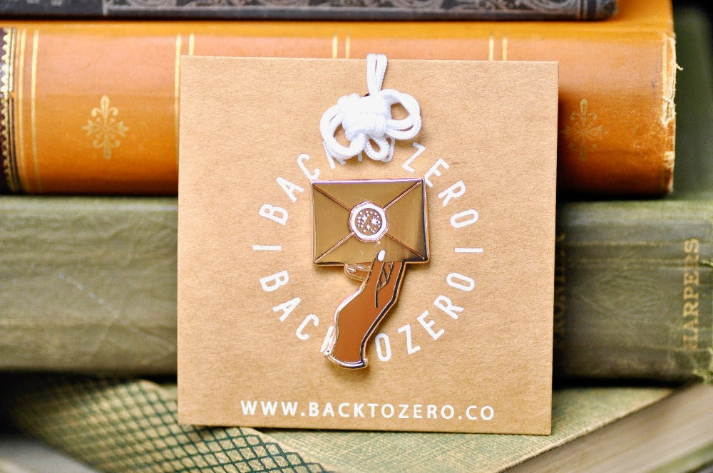 Hand Holding Wax Seal Letter Enamel Pin | Rose Gold - Backtozero B20 - enamel, hand, hand gesture, hard enamel, hard enamel pin, her, hold, holding, lapel, Letter, Letters, love letter, mail, metal, metal pin, pin, rose gold, wax seal, White