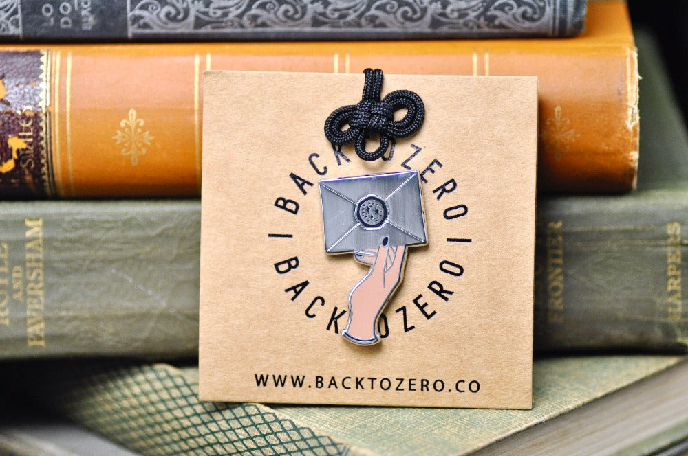 Hand Holding Wax Seal Letter Enamel Pin | Silver - Backtozero B20 - Black, enamel, hand, hand gesture, hard enamel, hard enamel pin, her, hold, holding, lapel, Letter, Letters, love letter, mail, metal, metal pin, pin, Silver, wax seal