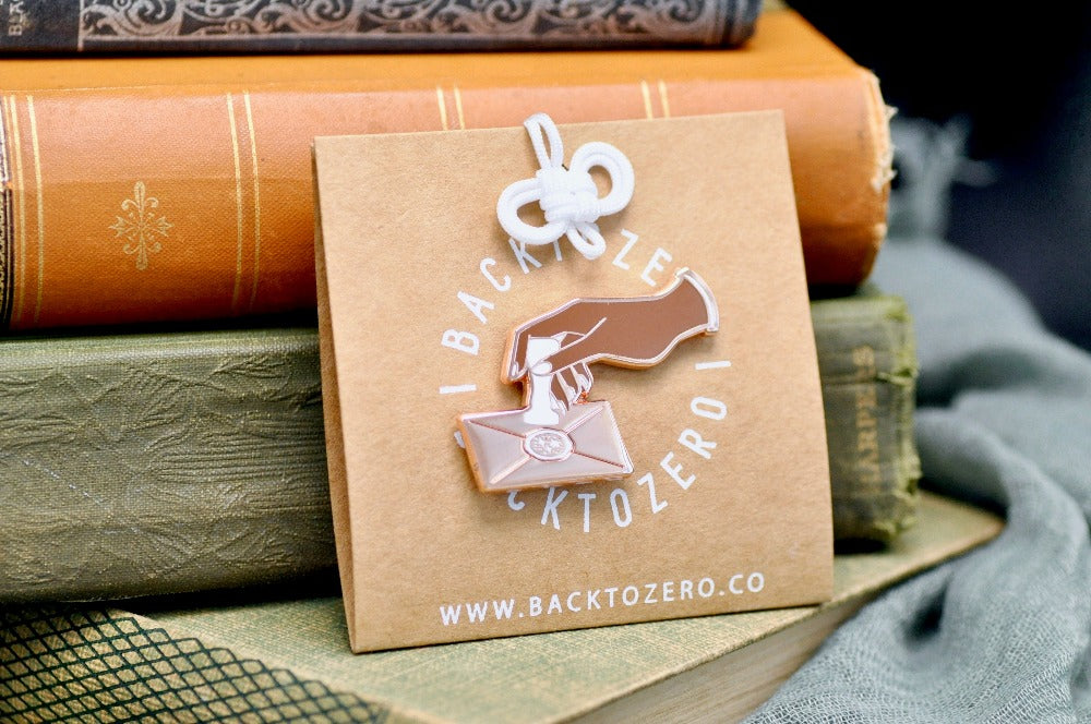 Hand Pressing Wax Seal Letter Enamel Pin | Rose Gold - Backtozero B20 - enamel, hand, hand gesture, hard enamel, hard enamel pin, her, lapel, Letter, Letters, love letter, mail, metal, metal pin, pin, press, rose gold, wax seal, White