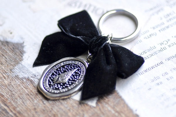 Message Wax Seal Keychain Black Bow | Seashell - Backtozero B20 - black bow, bow, cleanses, enamel, enamel keychain, her, keychain, lapel, metal, ribbon, seashell, Silver, soft enamel, soul, starry, velvet, wax seal