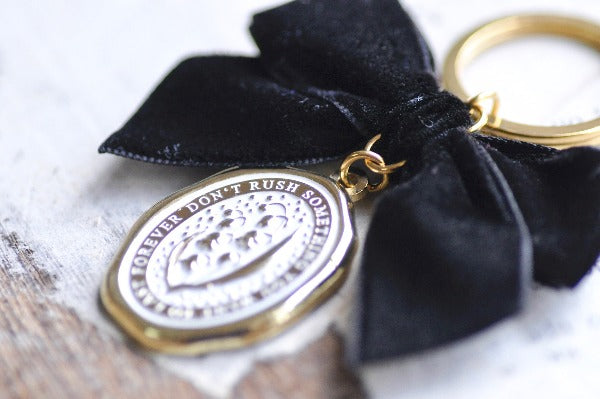 Message Wax Seal Keychain Black Bow Gold | Lily of the Valley - Backtozero B20 - black bow, botanic, Botanical, bow, charm, enamel, enamel keychain, Flower, her, keychain, lapel, lily of the valley, metal, Nature, Plant, plants, ribbon, soft enamel, starry, velvet, wax seal