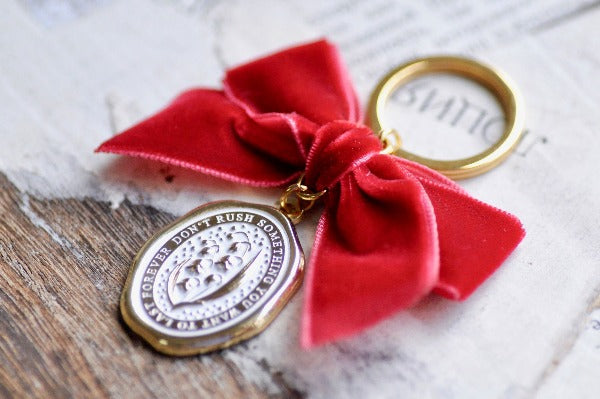 Message Wax Seal Keychain Red Bow | Lily of the Valley - Backtozero B20 - botanic, Botanical, bow, charm, enamel, enamel keychain, Flower, her, keychain, lapel, lily of the valley, metal, Nature, Plant, plants, Red, ribbon, soft enamel, starry, velvet, wax seal