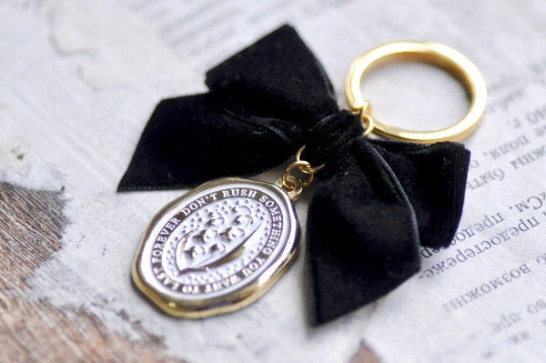 Message Wax Seal Keychain Black Bow Gold | Lily of the Valley - Backtozero B20 - black bow, botanic, Botanical, bow, charm, enamel, enamel keychain, Flower, her, keychain, lapel, lily of the valley, metal, Nature, Plant, plants, ribbon, soft enamel, starry, velvet, wax seal