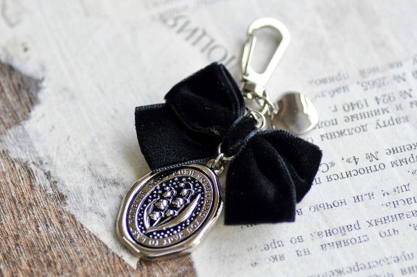 Message Wax Seal Charm Keychain Black Bow & Heart | Lily of the Valley - Backtozero B20 - bow, charm, enamel, enamel keychain, Flower, heart, her, keychain, lapel, lily of the valley, metal, ribbon, seashell, soft enamel, starry, velvet, wax seal