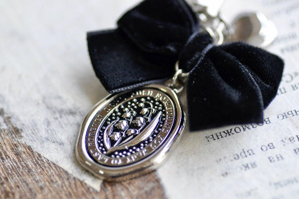 Message Wax Seal Charm Keychain Black Bow & Heart | Lily of the Valley - Backtozero B20 - bow, charm, enamel, enamel keychain, Flower, heart, her, keychain, lapel, lily of the valley, metal, ribbon, seashell, soft enamel, starry, velvet, wax seal
