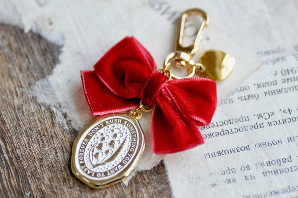 Message Wax Seal Charm Keychain Red Bow & Heart | Lily of the Valley - Backtozero B20 - botanic, Botanical, bow, charm, enamel, enamel keychain, Flower, Heart, her, keychain, lapel, lily of the valley, metal, Nature, Plant, plants, Red, ribbon, soft enamel, starry, velvet, wax seal