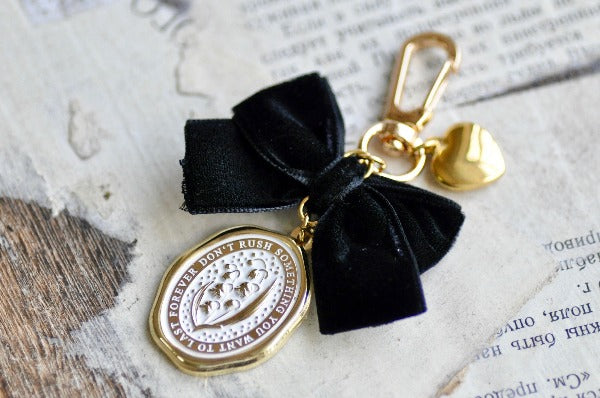 Message Wax Seal Charm Keychain Black Bow & Gold Heart | Lily of the Valley - Backtozero B20 - black bow, botanic, Botanical, bow, charm, enamel, enamel keychain, Flower, gold heart, Heart, her, keychain, lapel, lily of the valley, metal, Nature, Plant, plants, ribbon, soft enamel, starry, velvet, wax seal