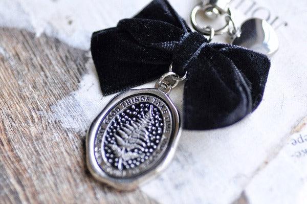 Message Wax Seal Charm Keychain Black Bow & Heart | Fern | Patience | S - Backtozero B20 - black bow, botanic, Botanical, bow, charm, Come to those who wait, enamel, enamel keychain, fern, Good things take time, Heart, her, keychain, lapel, metal, Nature, newarrivals, Plant, plants, ribbon, silver, soft enamel, starry, velvet, wax seal