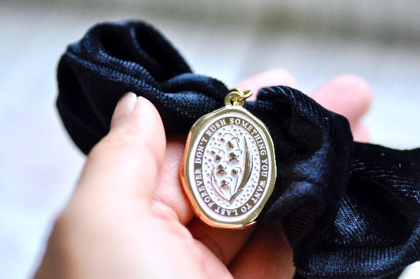 Message Enamel Wax Seal Charm Scrunchie | Velvet Black | Lily of the Valley - Backtozero B20 - accessory, Black, botanic, Botanical, enamel, Flower, Gold, hair, her, lapel, lily of the valley, metal, Plant, plants, scrunchie, soft enamel, starry, velvet, wax seal