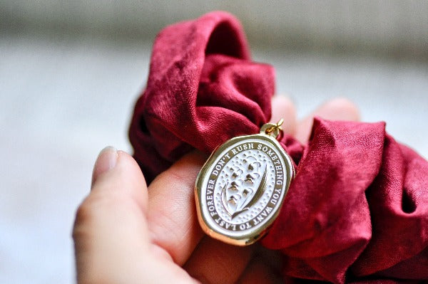 Message Enamel Wax Seal Charm Scrunchie | Satin Red | Lily of the Valley - Backtozero B20 - accessory, botanic, Botanical, enamel, Flower, Gold, hair, her, lapel, lily of the valley, metal, Nature, satin, scrunchie, soft enamel, starry, wax seal